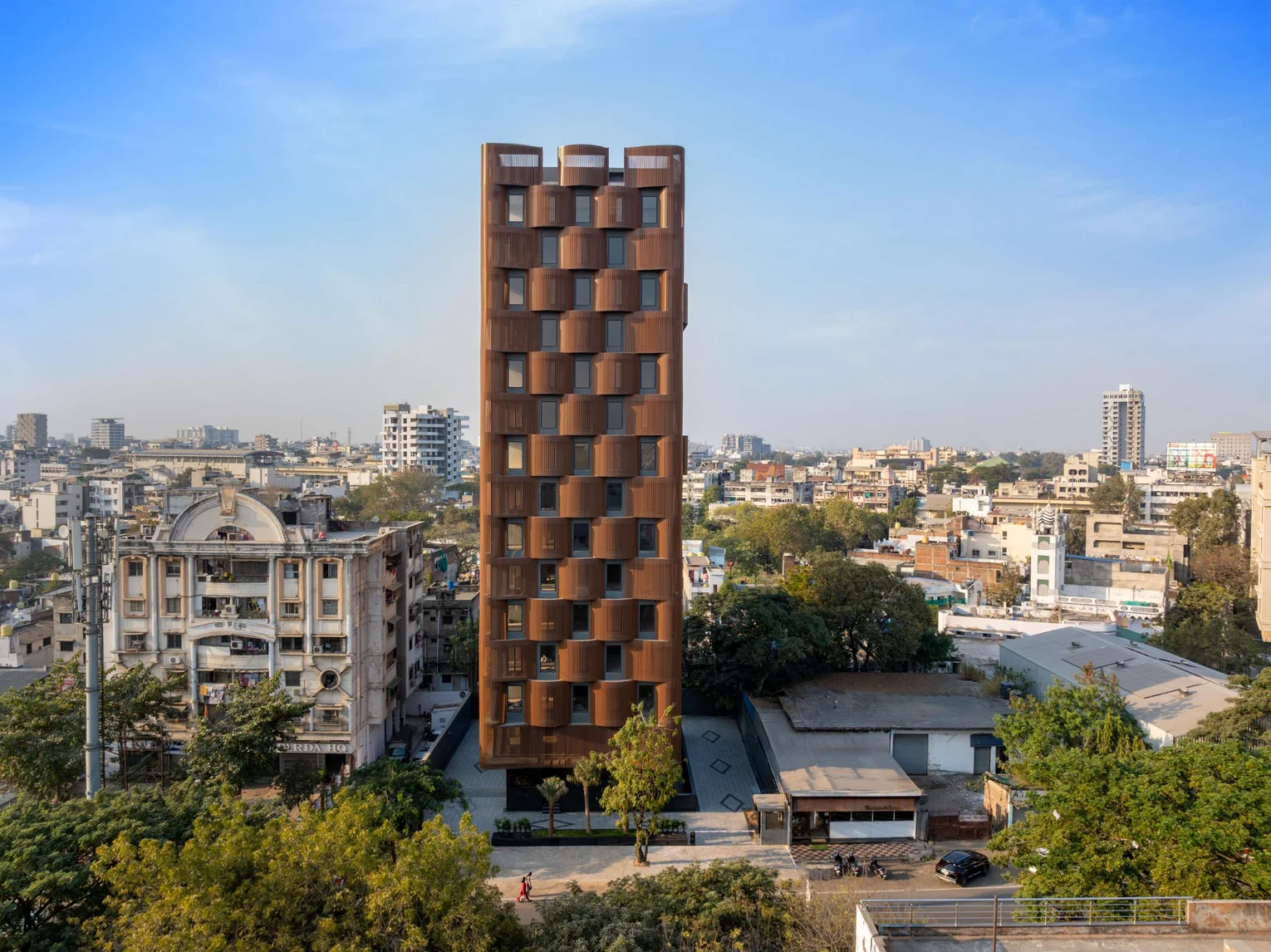 a tall office block with a brownish-reddish façade