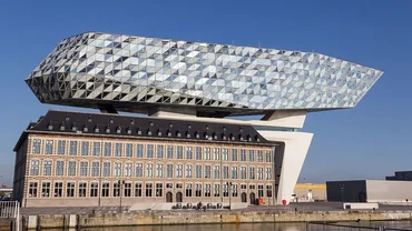 Old building with modern construction with glass façade above